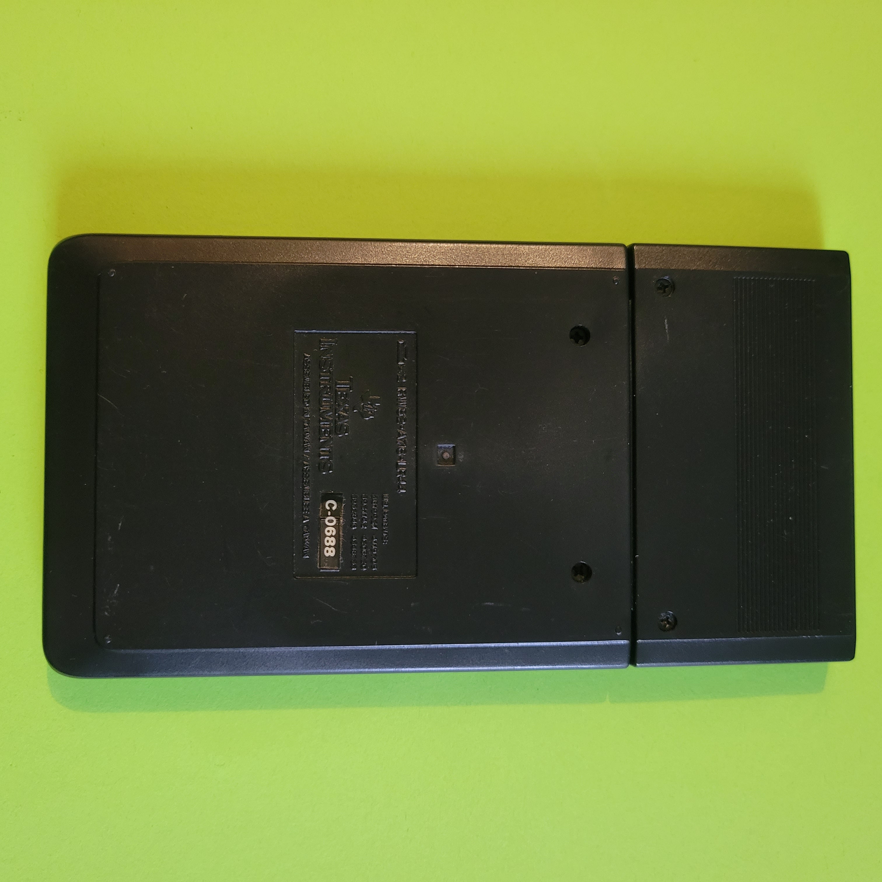An image of the back of a texas instruments ti-32 scientific/engineering calculator